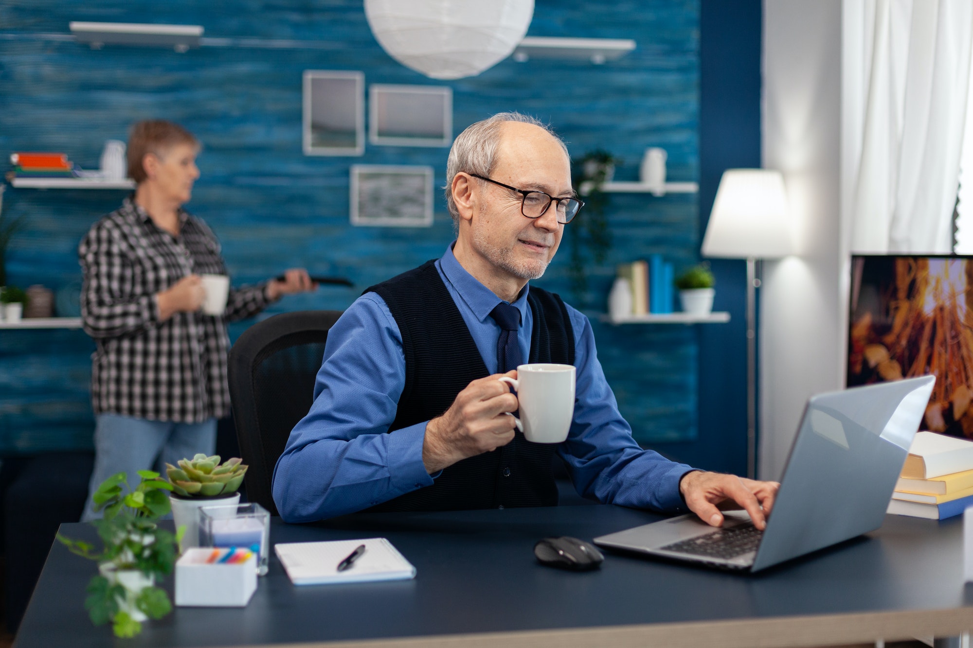 Happy senior man after reading a email